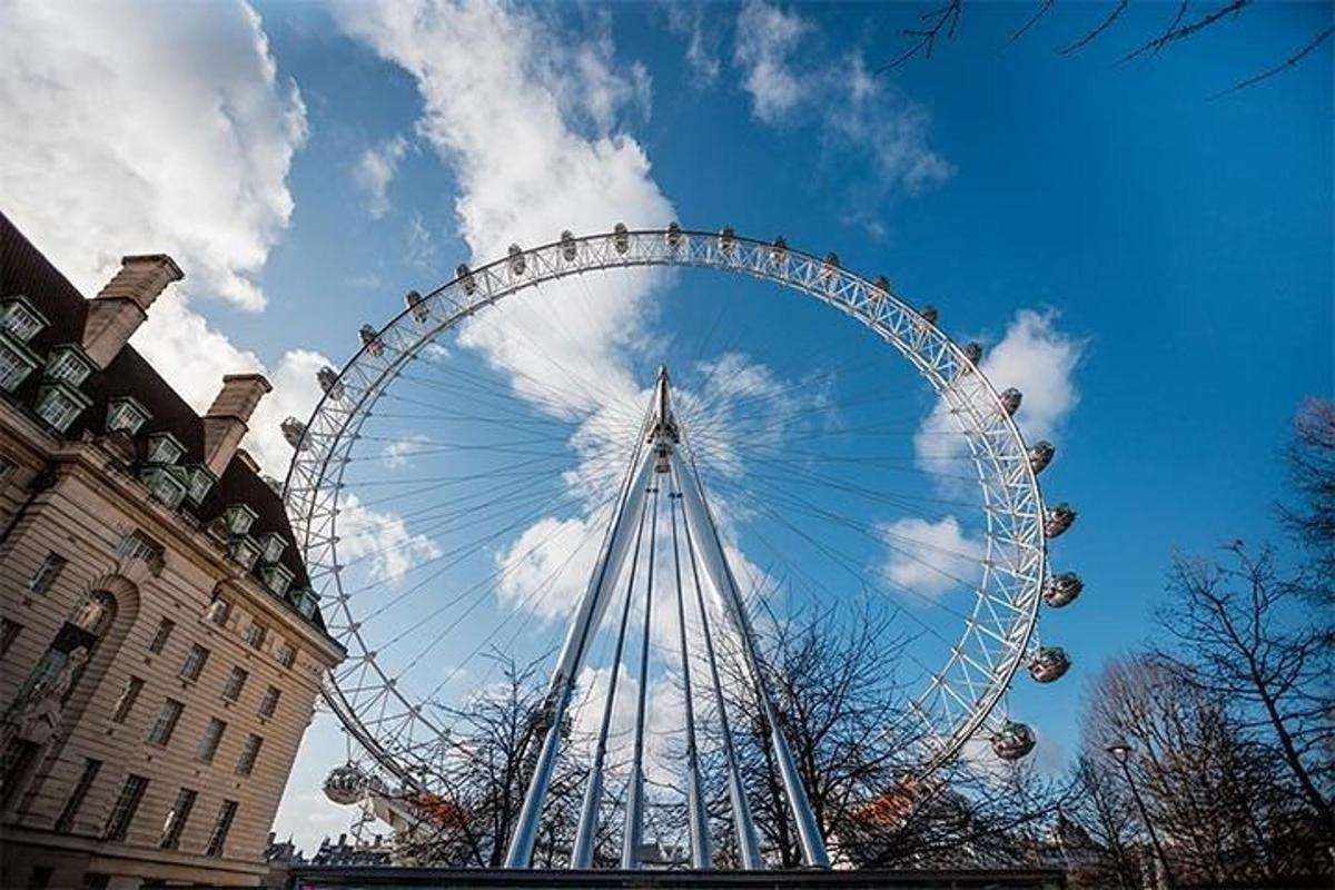 a large ferris wheel in front of a building
