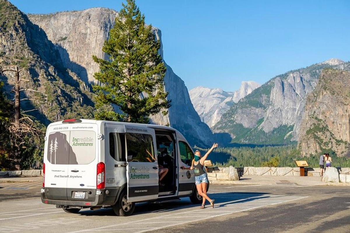 a woman is standing next to a van