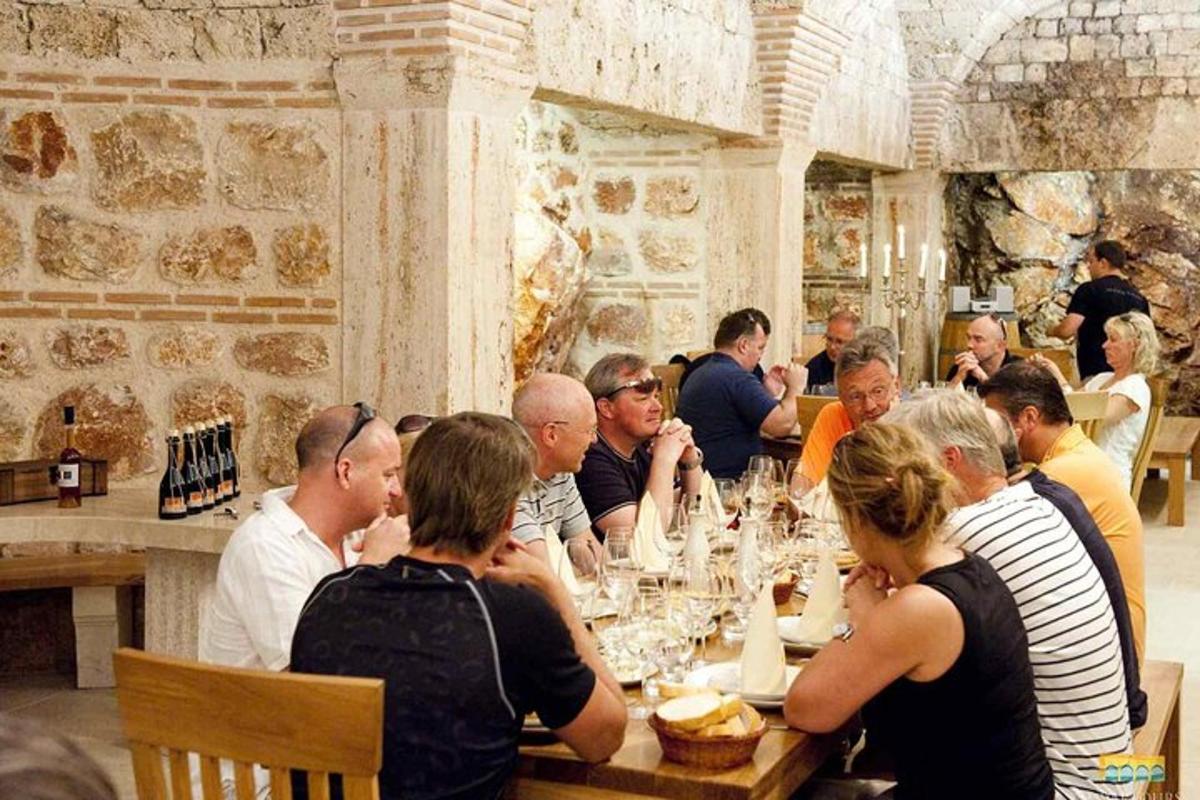 a group of people sitting at a table in a restaurant