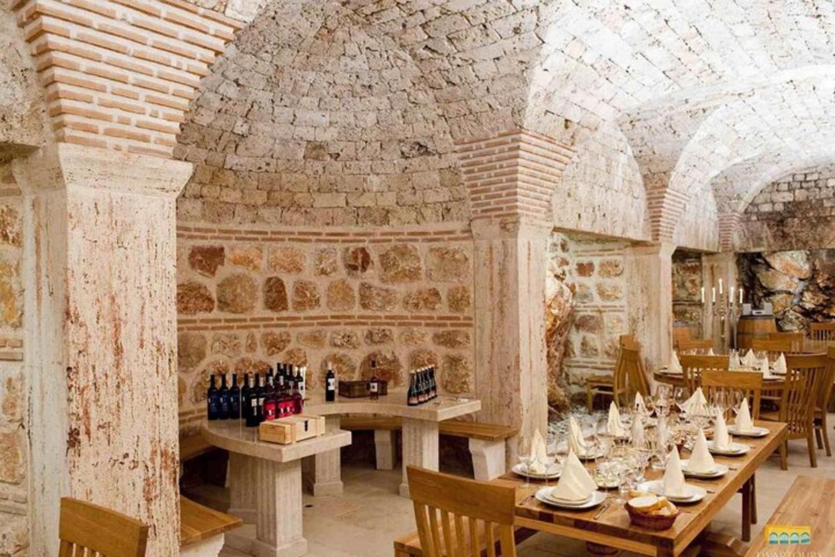 a dining room with tables and a brick wall