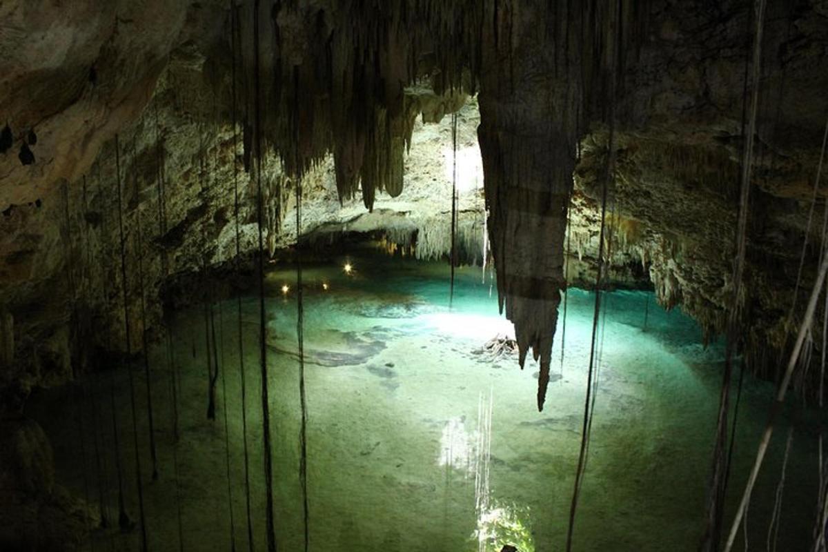 a cave with a pool of water in it