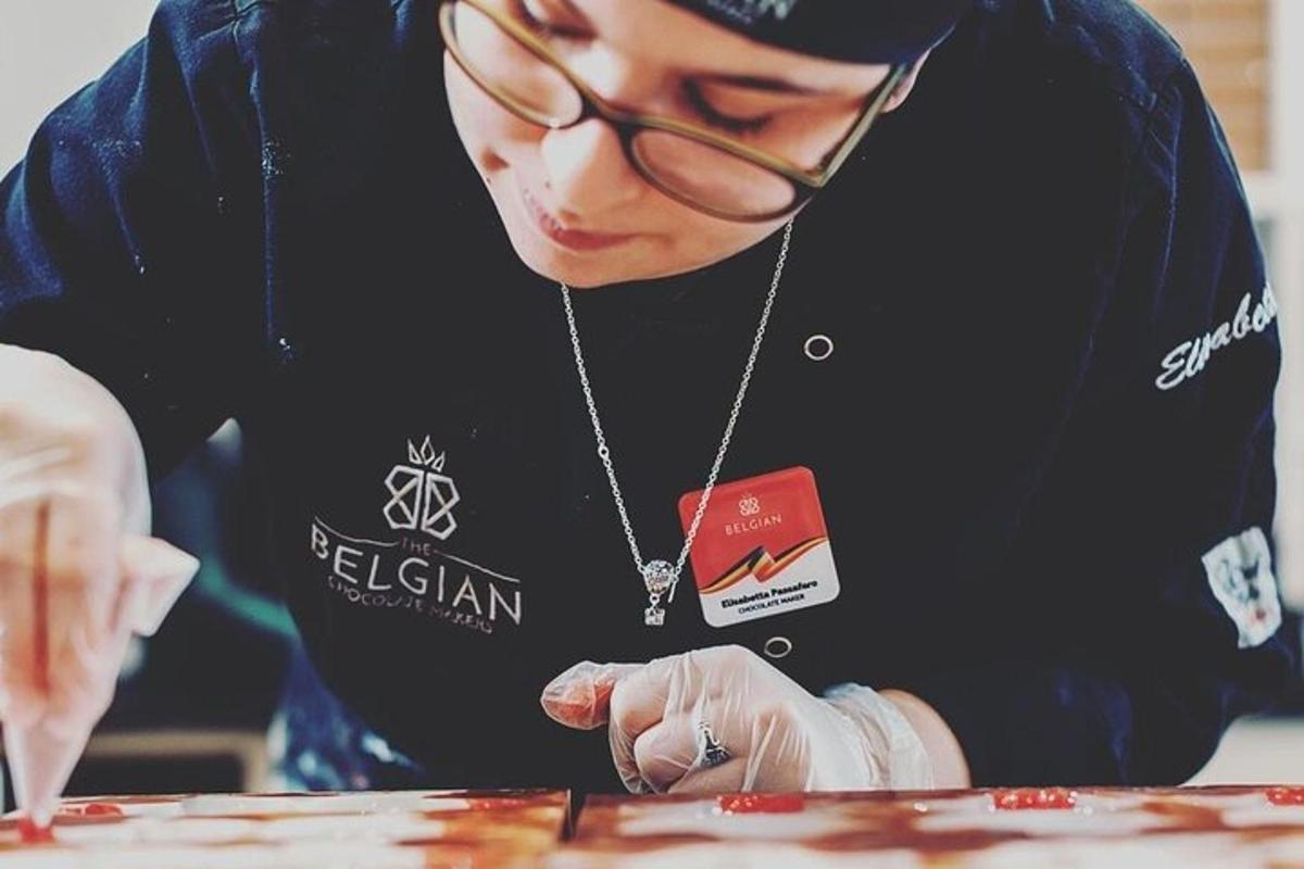 a woman wearing a necklace and glasses is cutting food