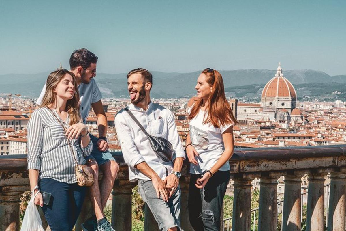 a group of people standing on a balcony looking at a city