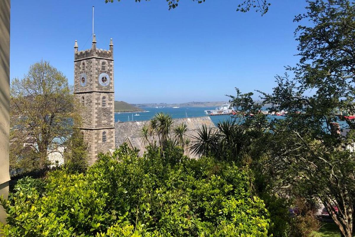 a tower with a clock on the side of a building