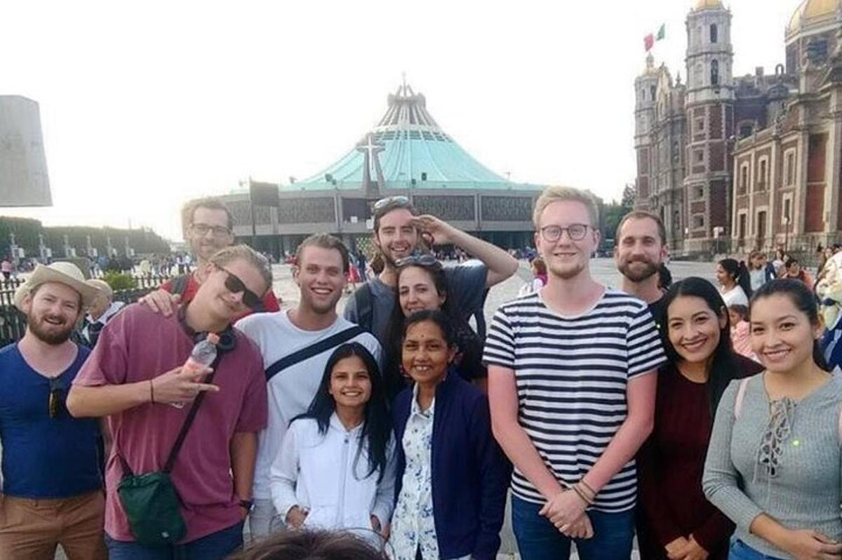 a group of people posing for a picture in a city
