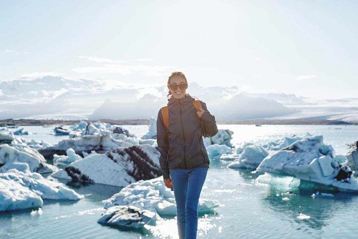 a woman standing on icebergs in the ocean