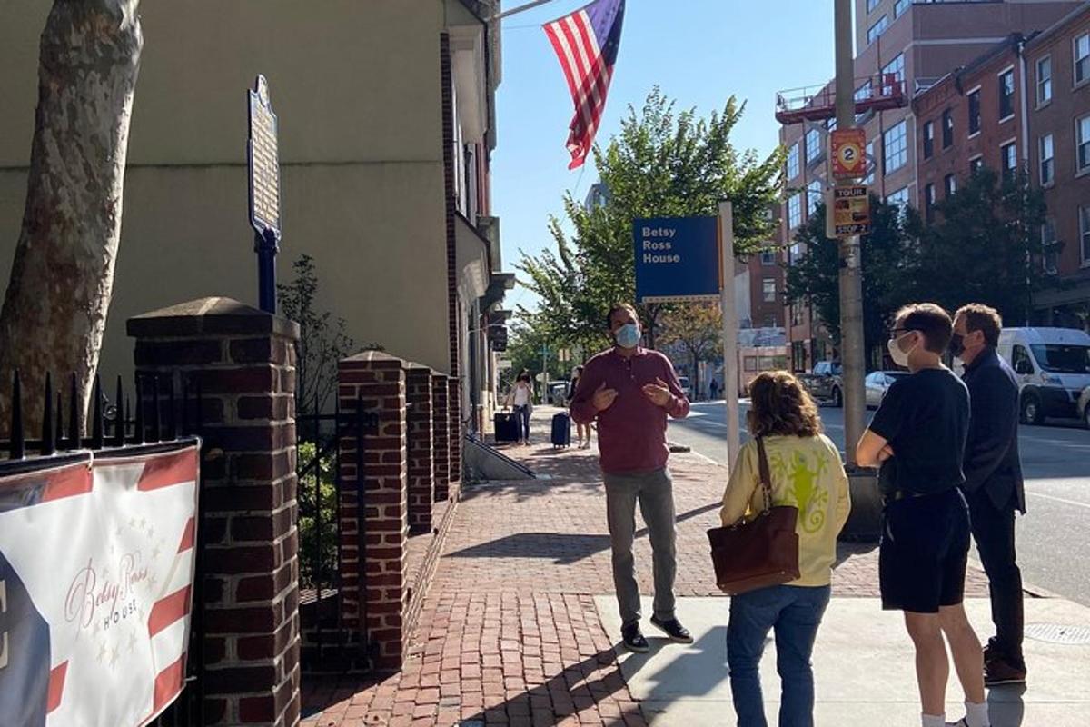 a group of people standing on a sidewalk