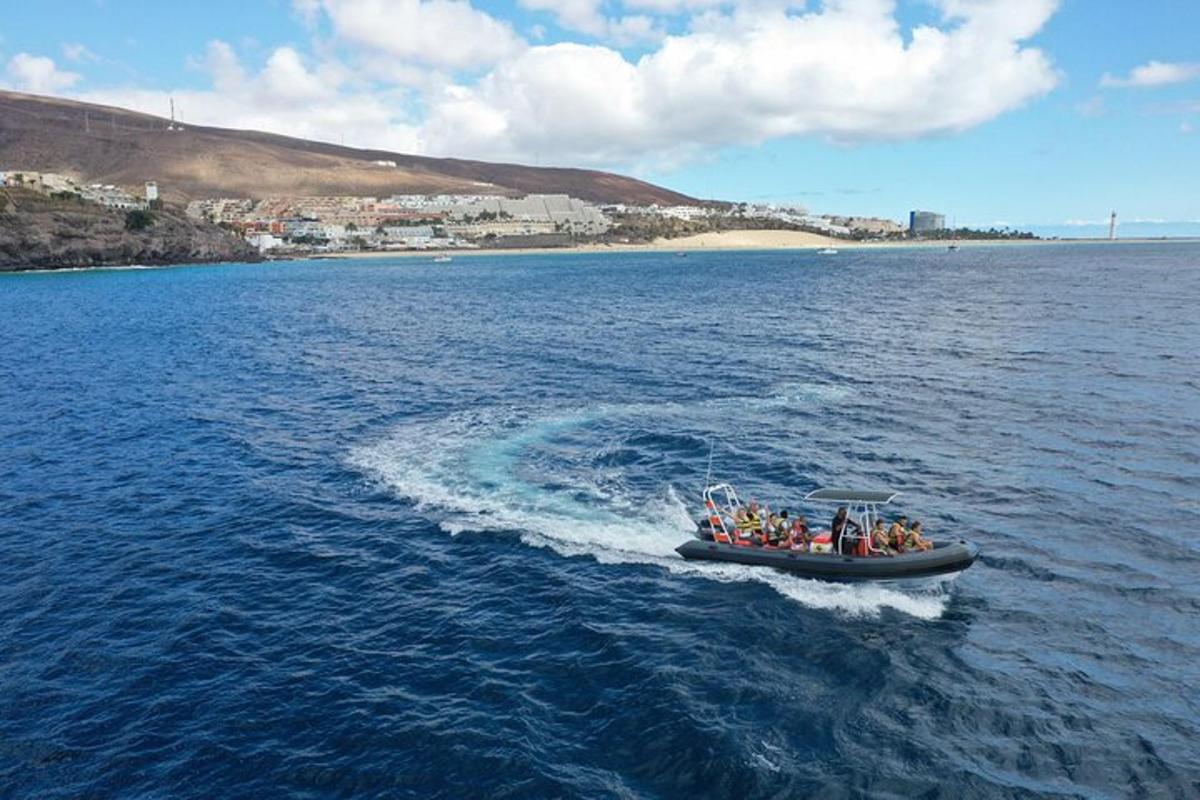 a group of people in a boat in the water