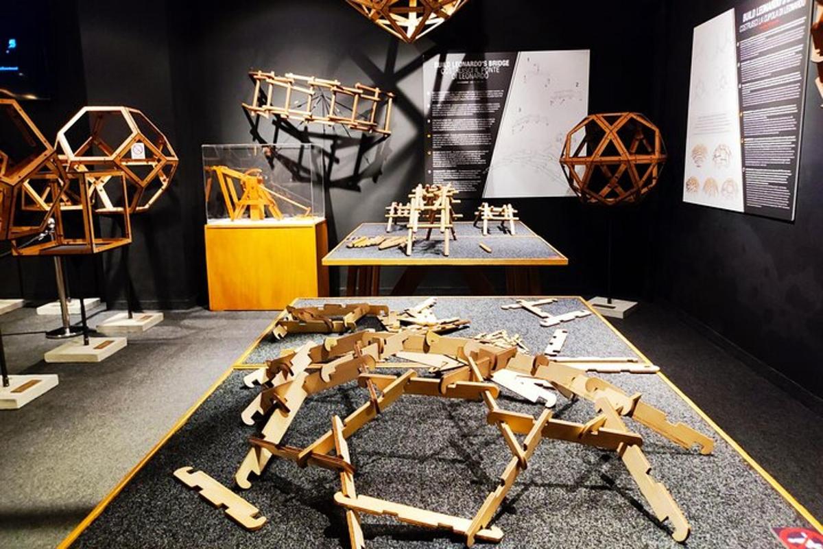 a group of wooden robots on display in a museum