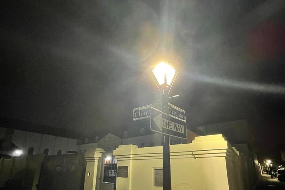 a street light with two street signs on it
