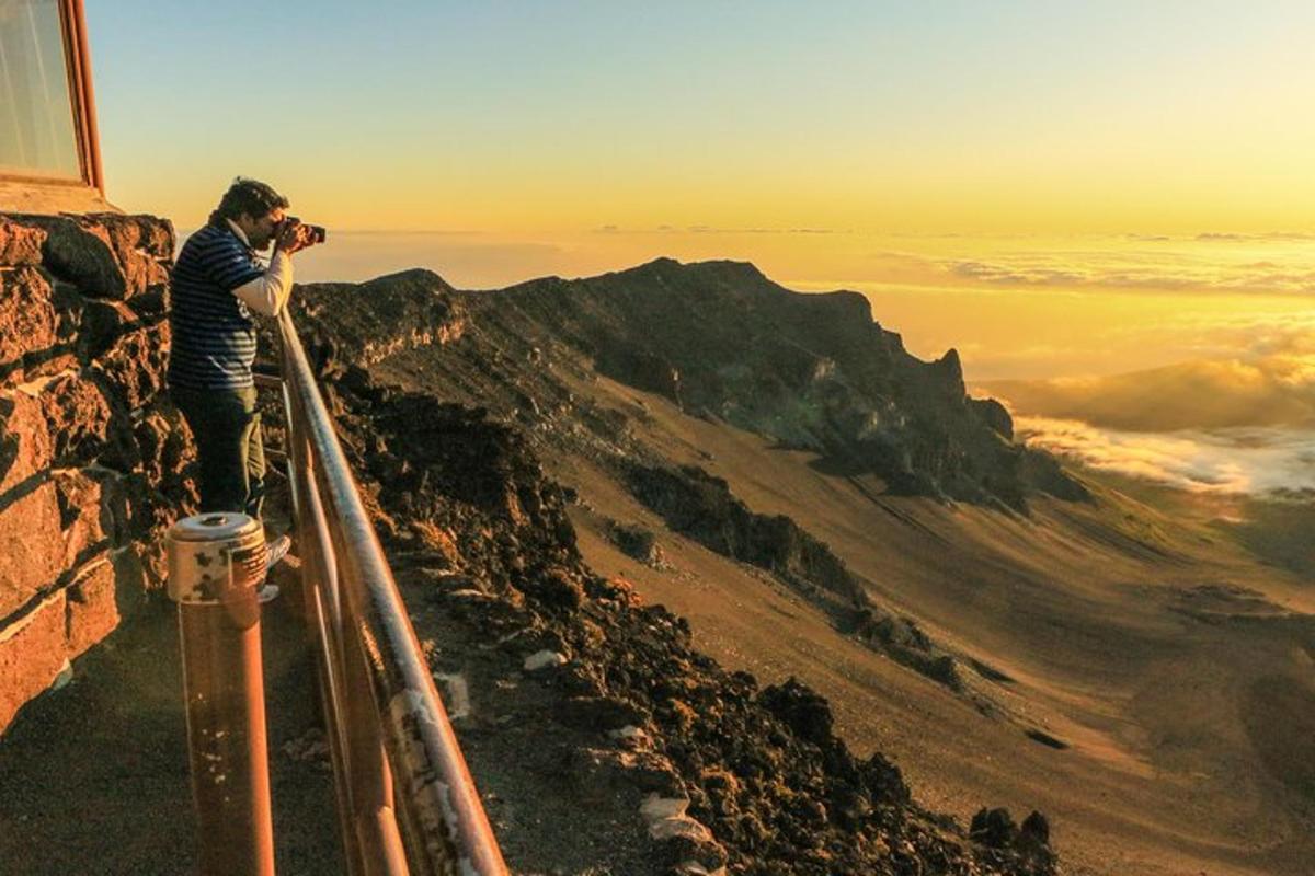 a man taking a picture of a mountain
