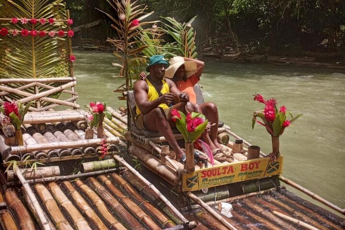 two people sitting on a boat in the water