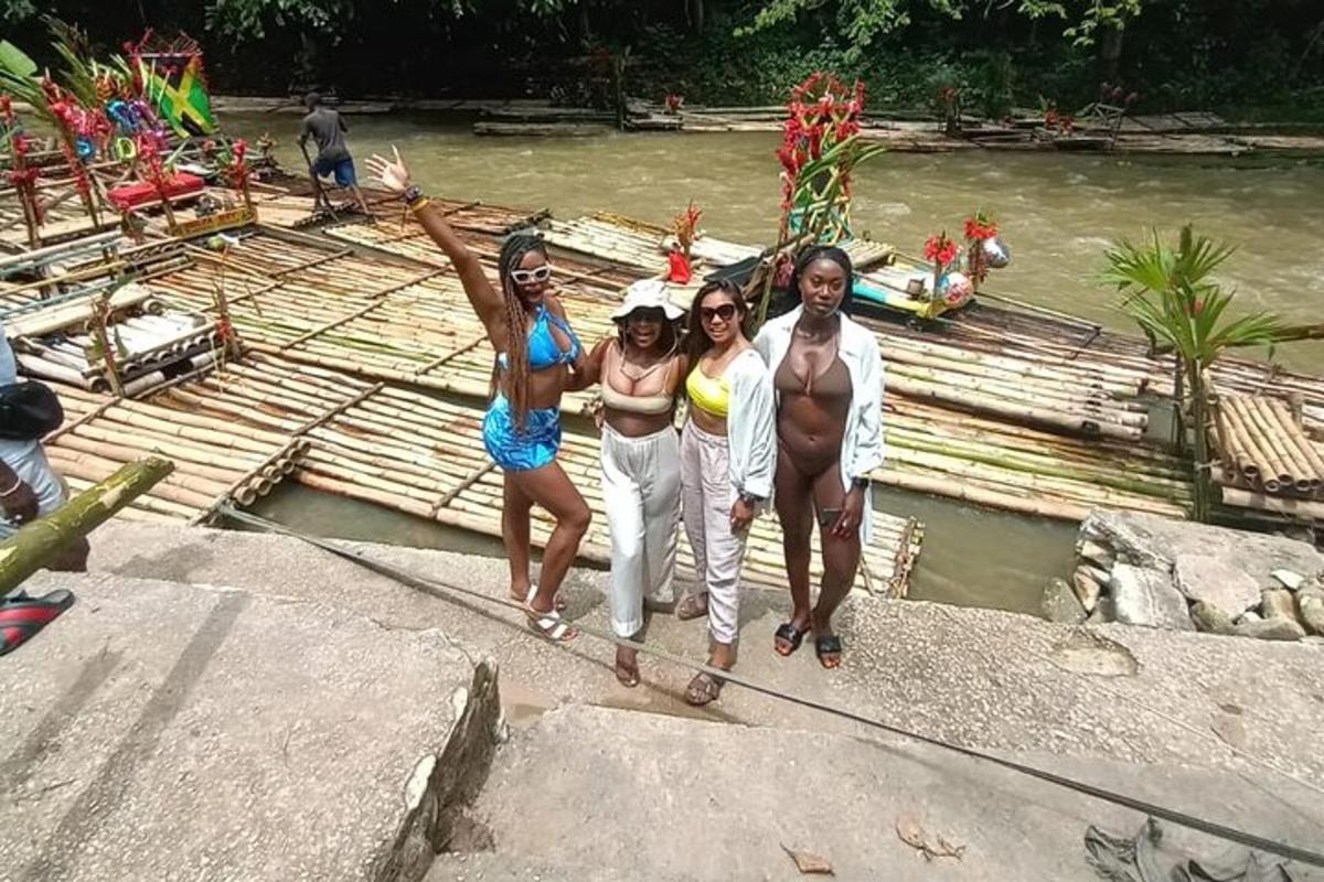 a group of people standing on a raft in the water