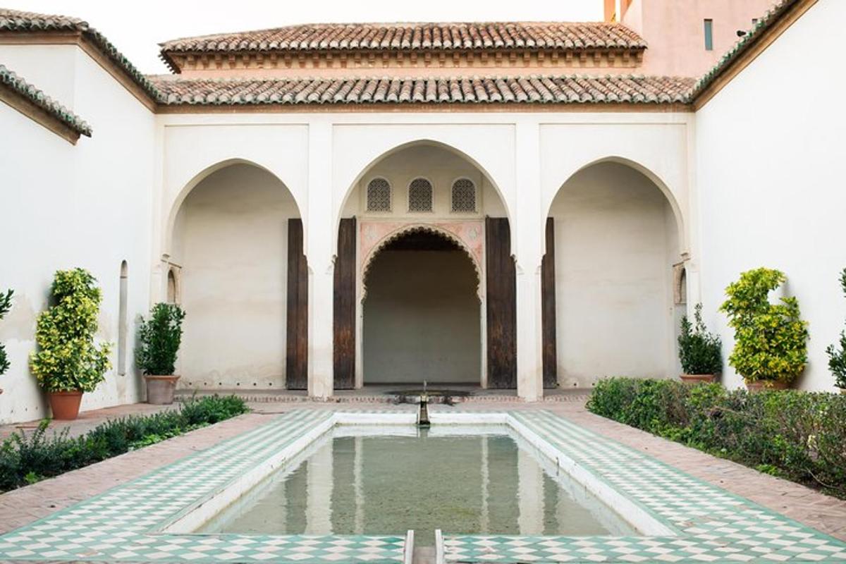 a courtyard of a building with a fountain