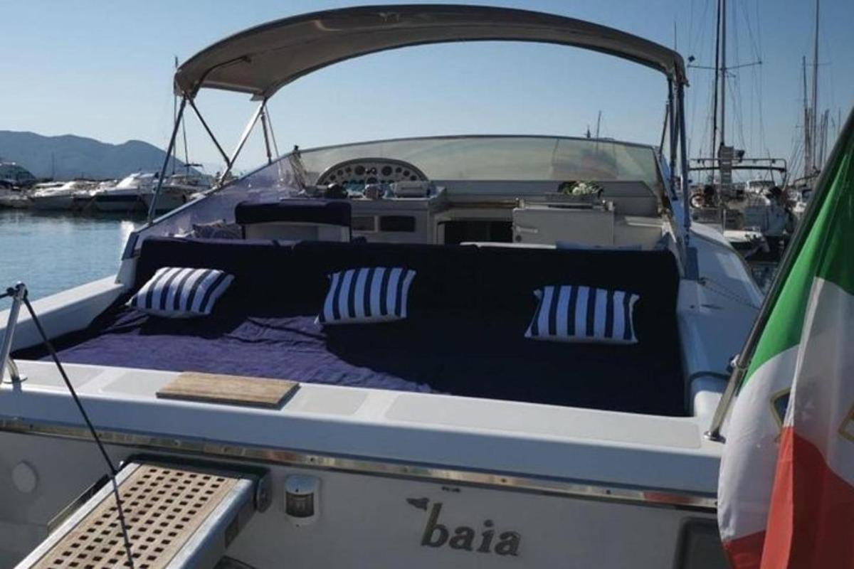 a boat with a bed in the back of it