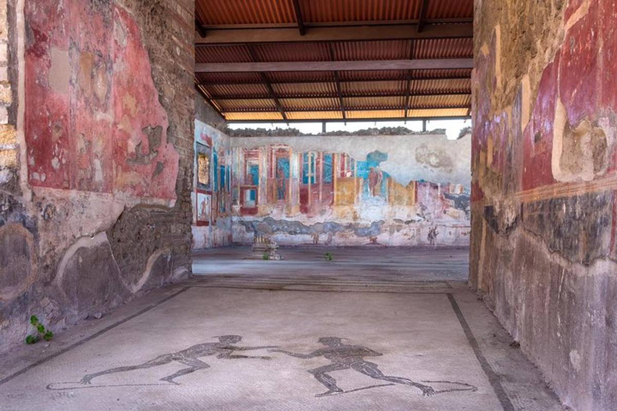 a room with paintings on the walls of a building