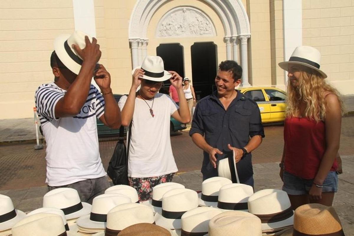 un groupe d'hommes debout autour d'une table de chapeaux