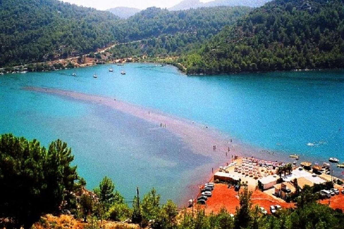 a view of a beach with boats in the water