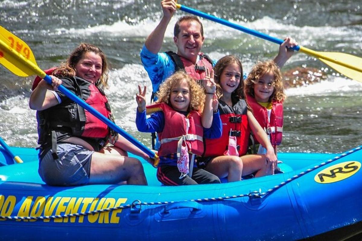 a group of people on a raft on a river