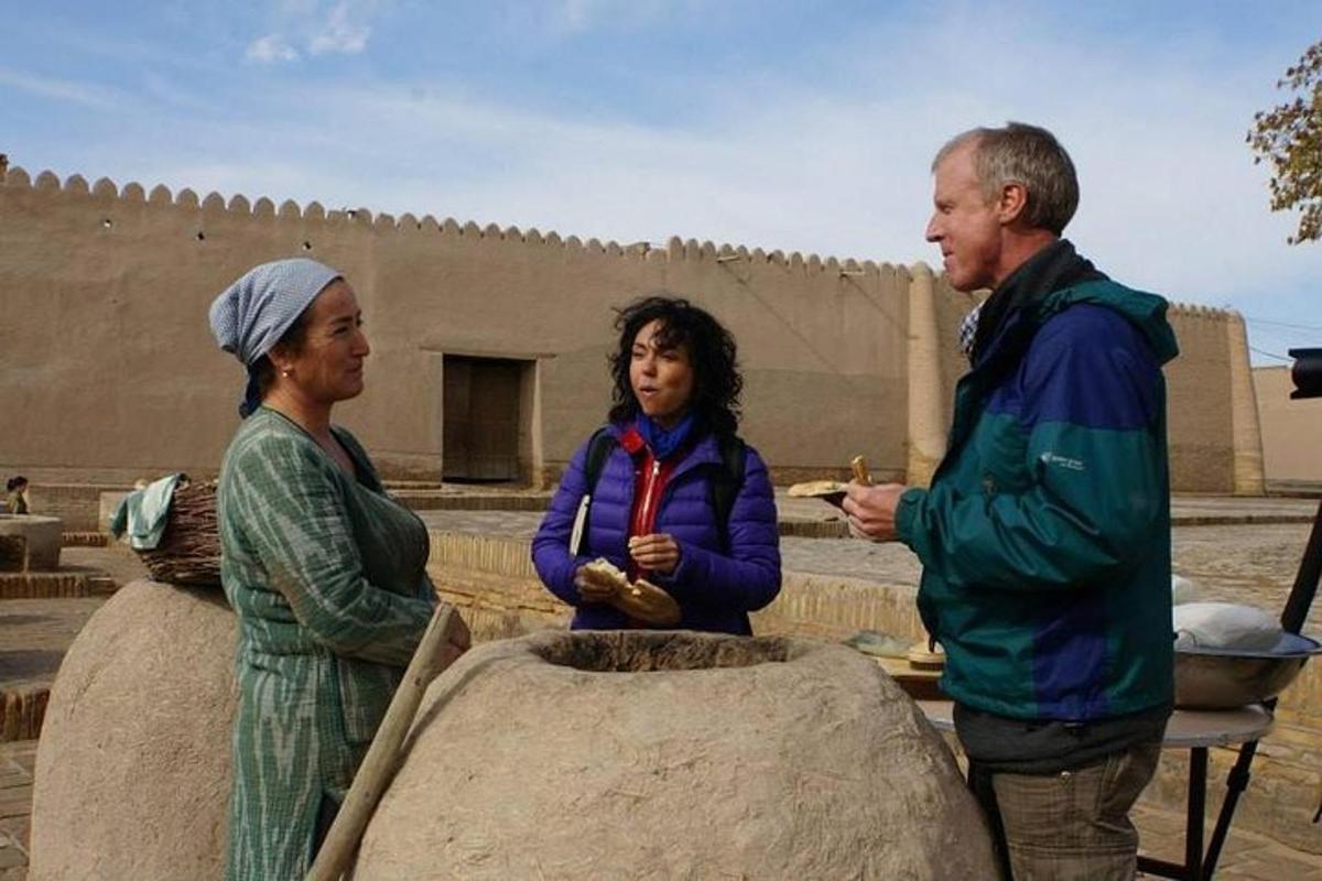 a man and two women standing in front of a building