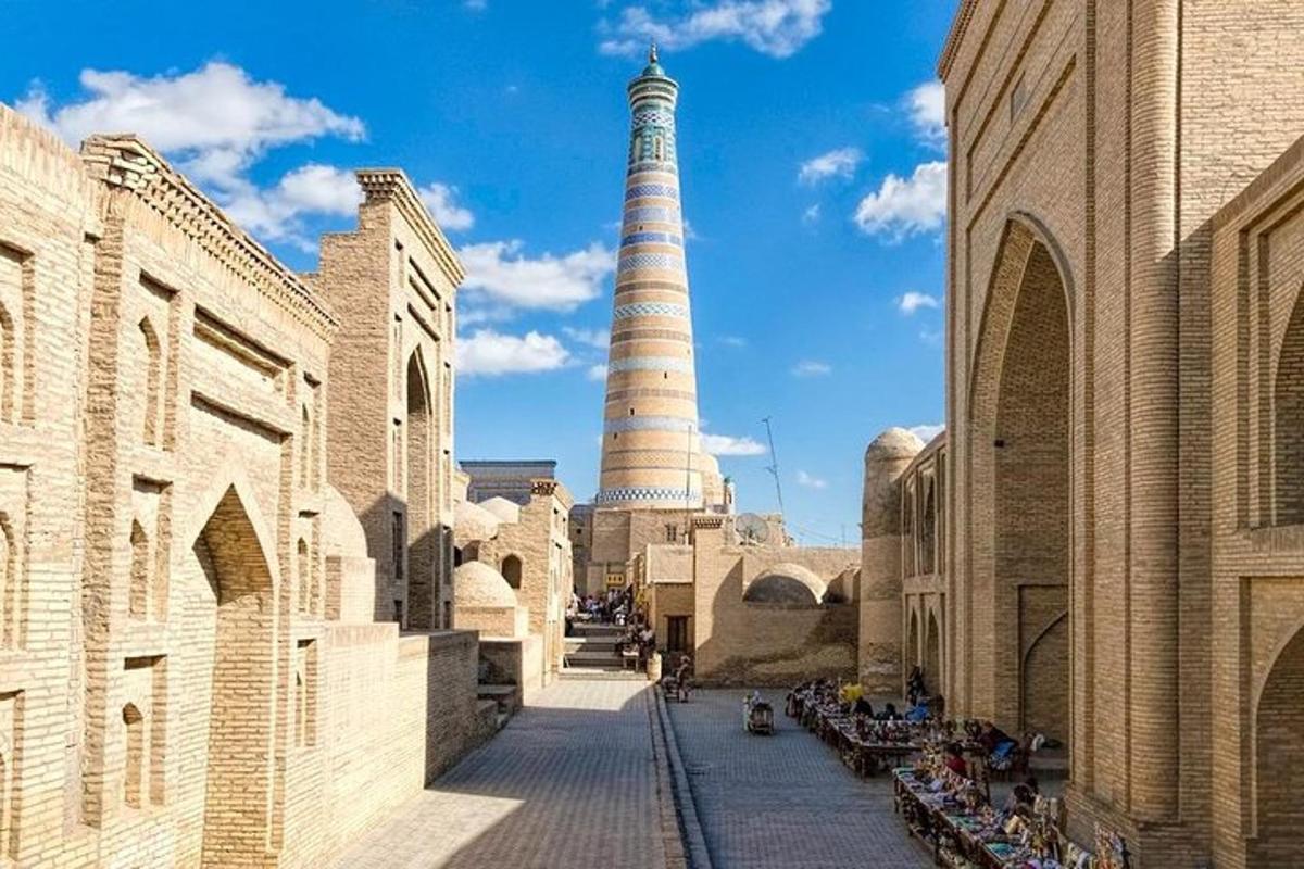 a view of a mosque with a lighthouse in the background