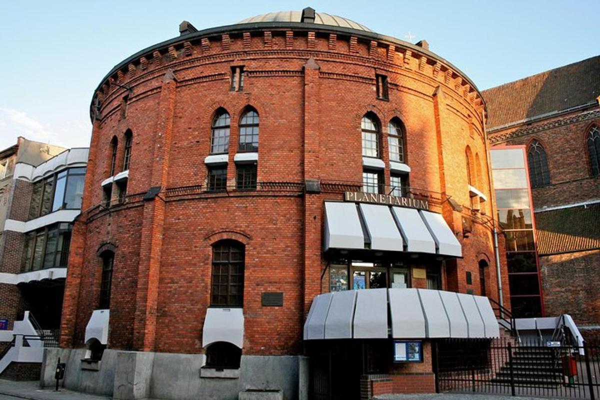 a red brick building with a round top