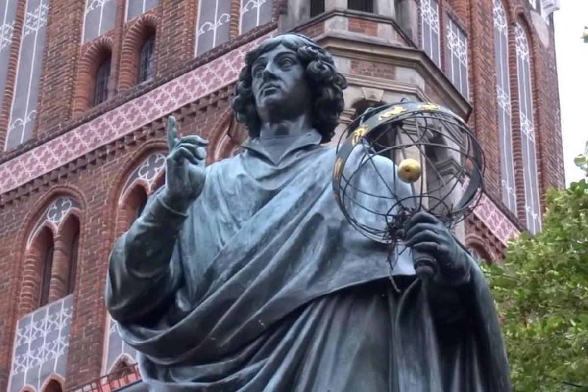 a statue of a man holding a ball