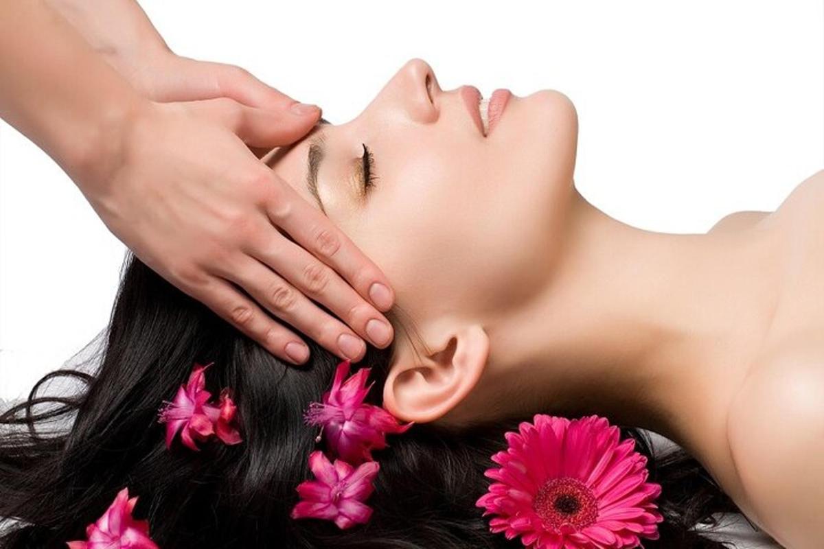 a woman with her hands on her face with flowers