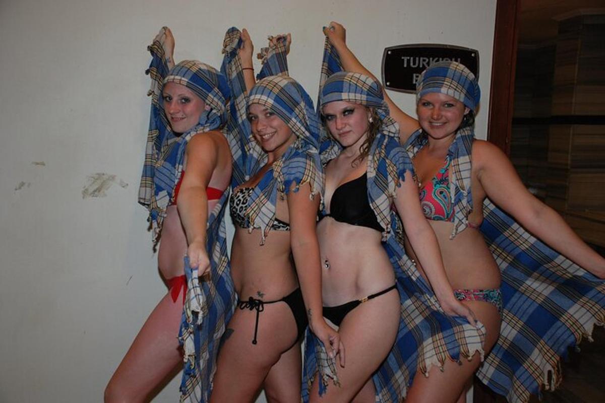 a group of women in bikinis posing for a picture