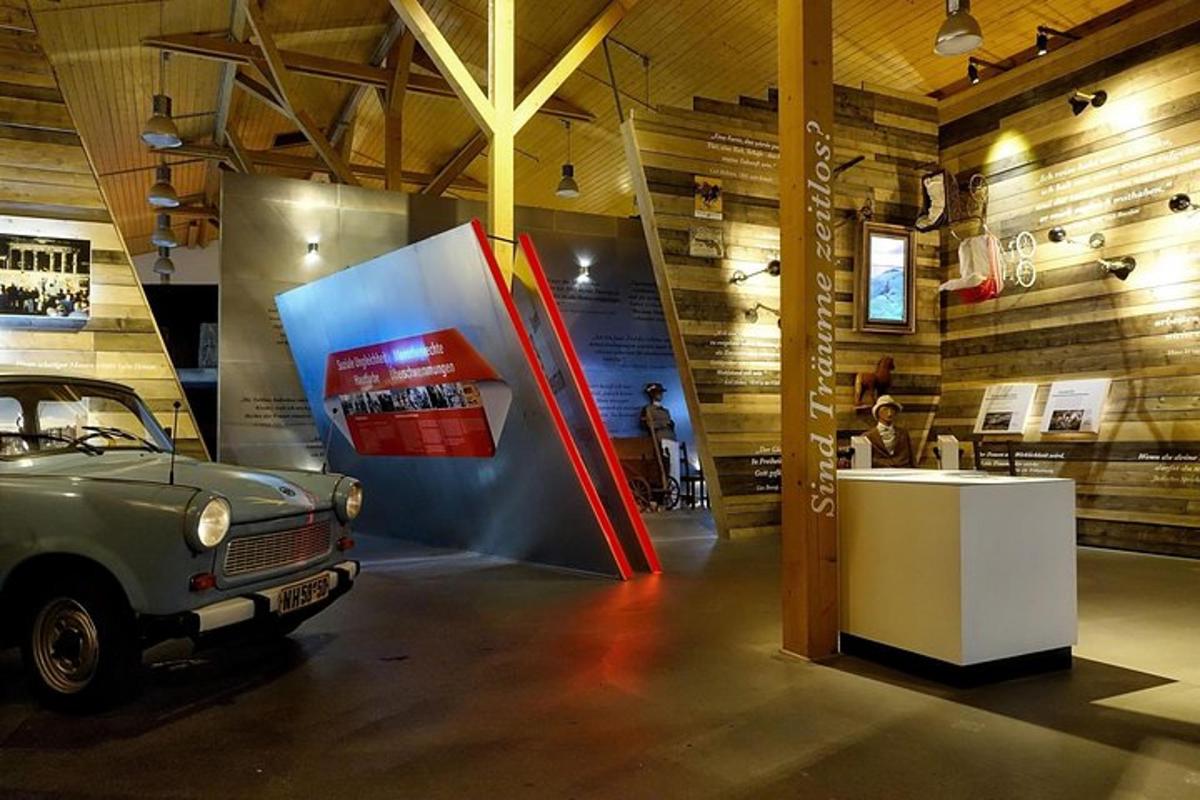 a museum with a car parked in a room