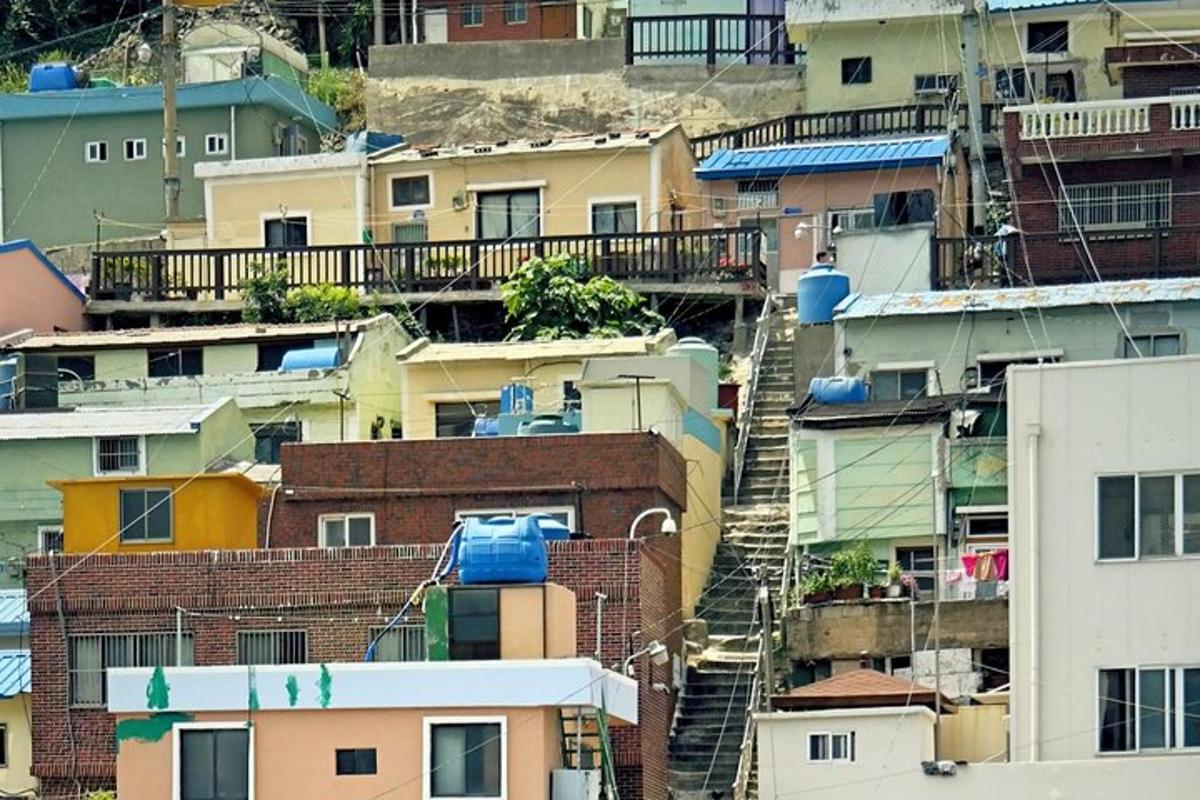 a group of buildings on a hill with a staircase
