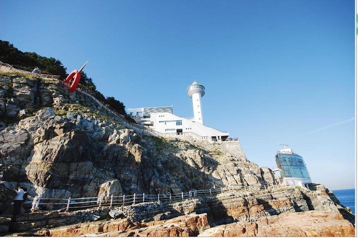 a lighthouse on the side of a rocky cliff