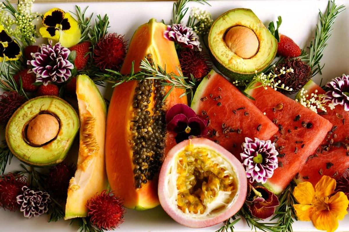 a plate of fruit and vegetables on a table