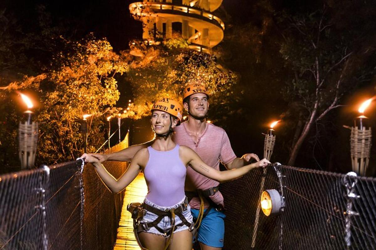 a man and a woman standing on a suspension bridge