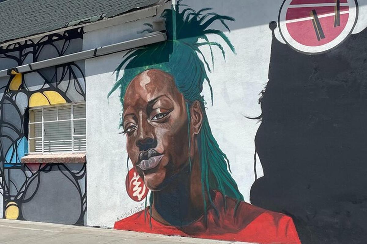 a painting of a woman on the side of a building