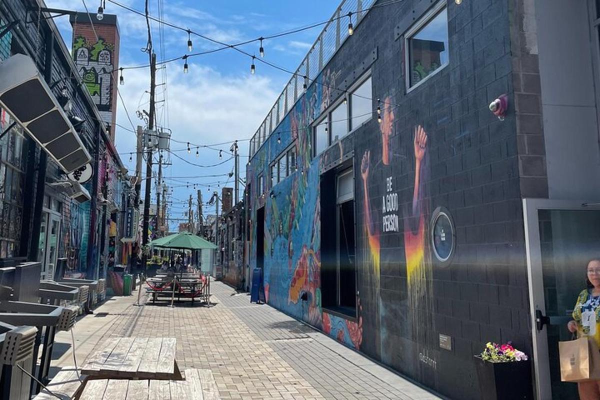 a street with graffiti on the side of a building