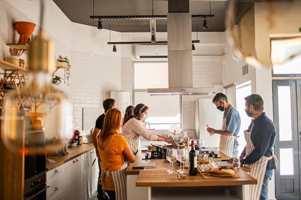 a group of people in a kitchen preparing food