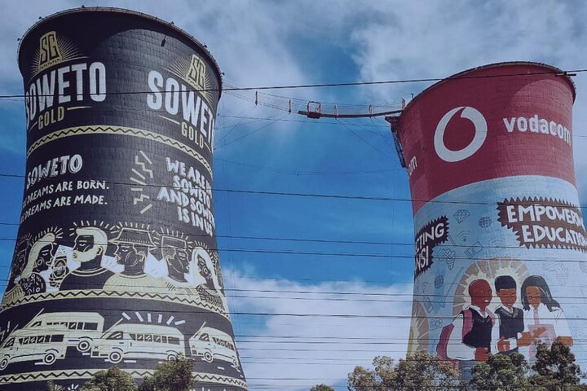 two large towers with paintings on the sides of them