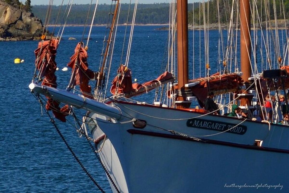 a large blue sail boat in the water