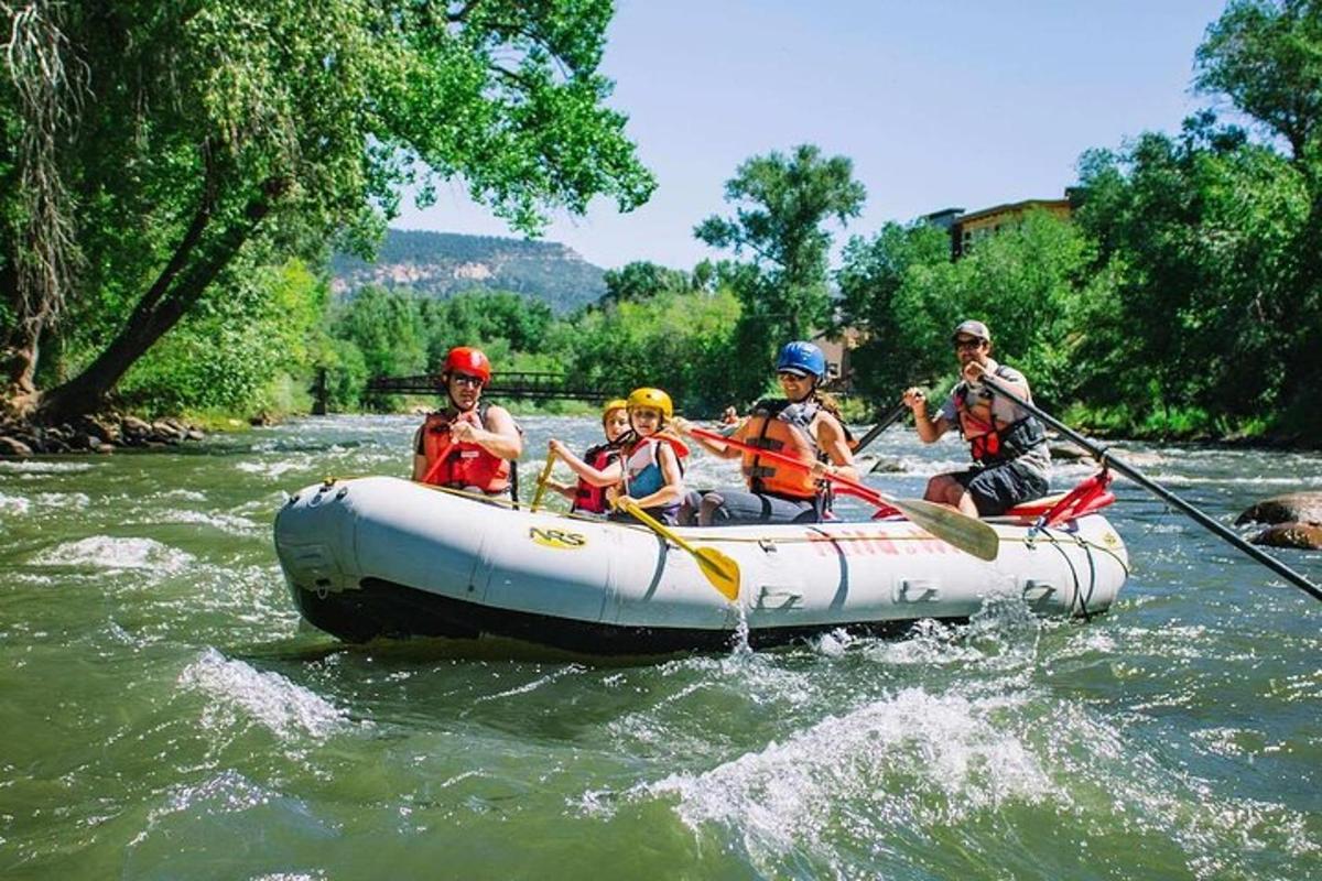 a group of people in a raft on a river