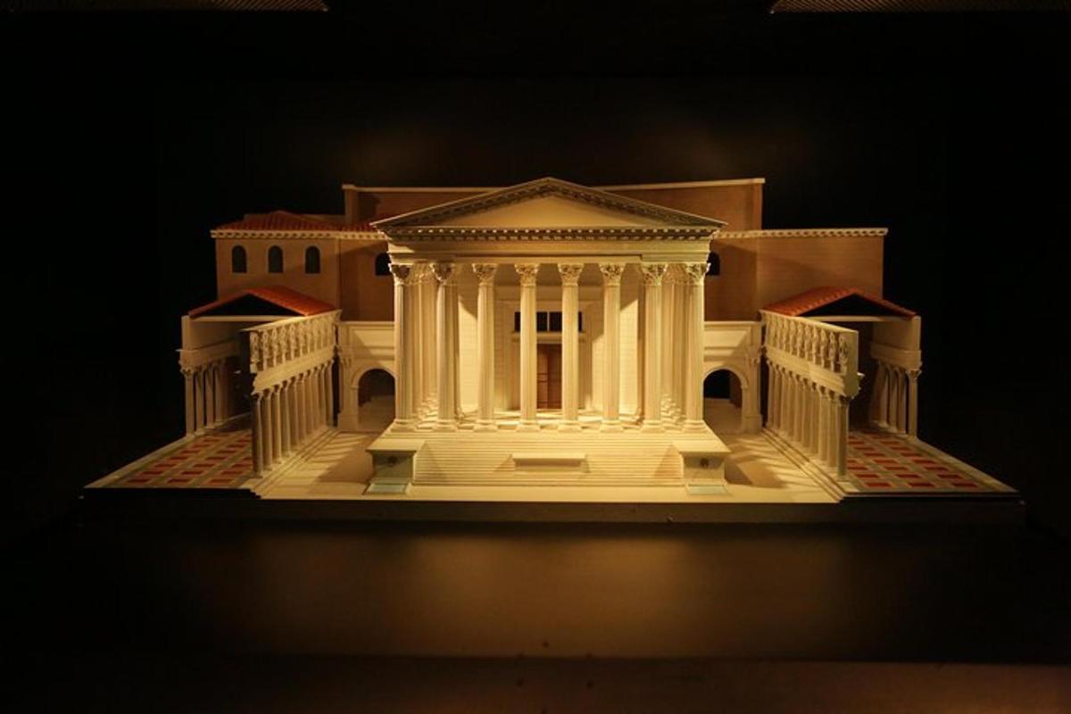 a white model of a building with a pillar