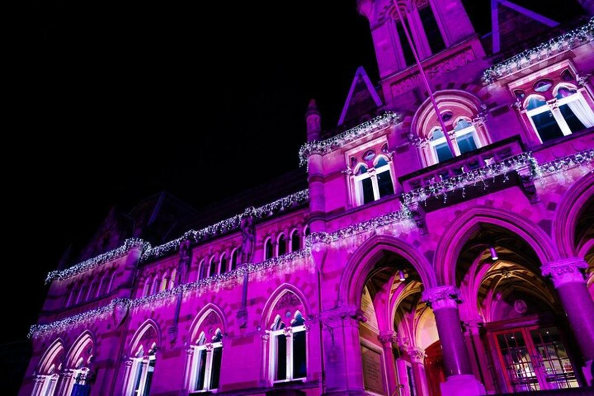 a building that is lit up in purple