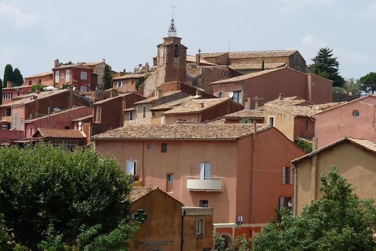 a group of houses in a town with a tower