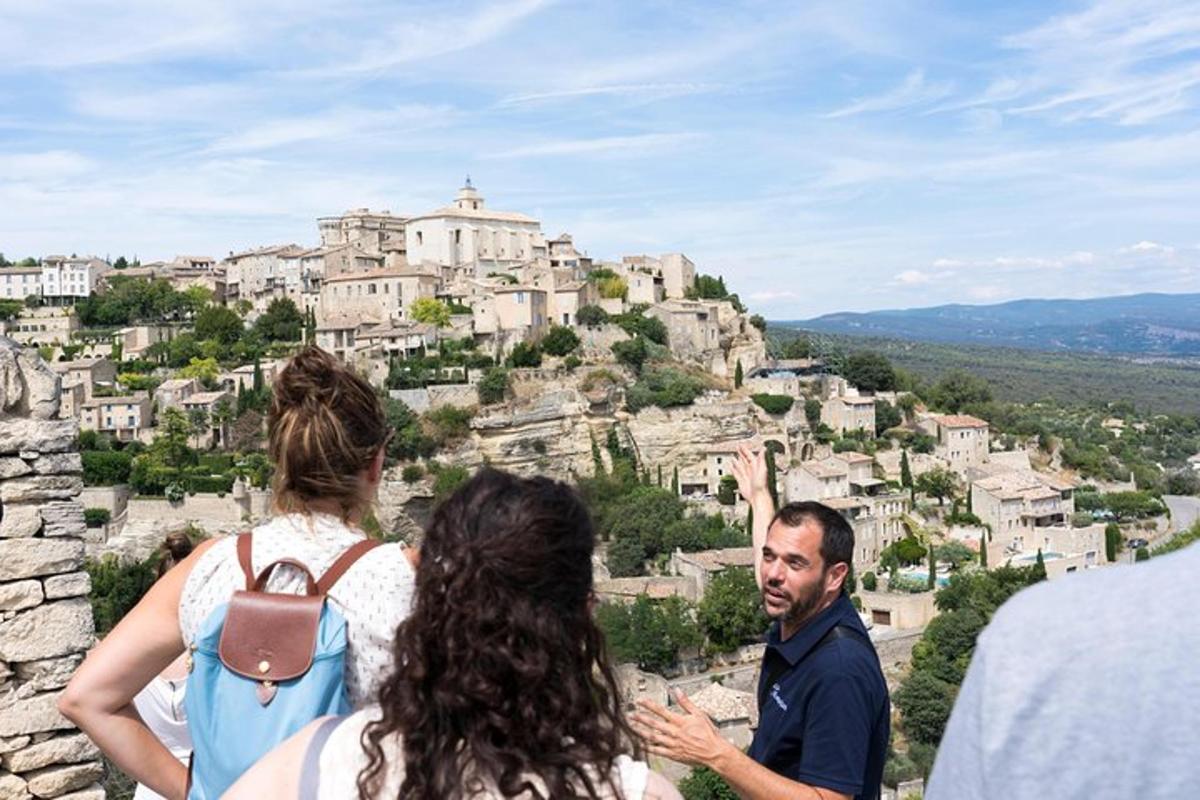 a group of people standing on top of a mountain