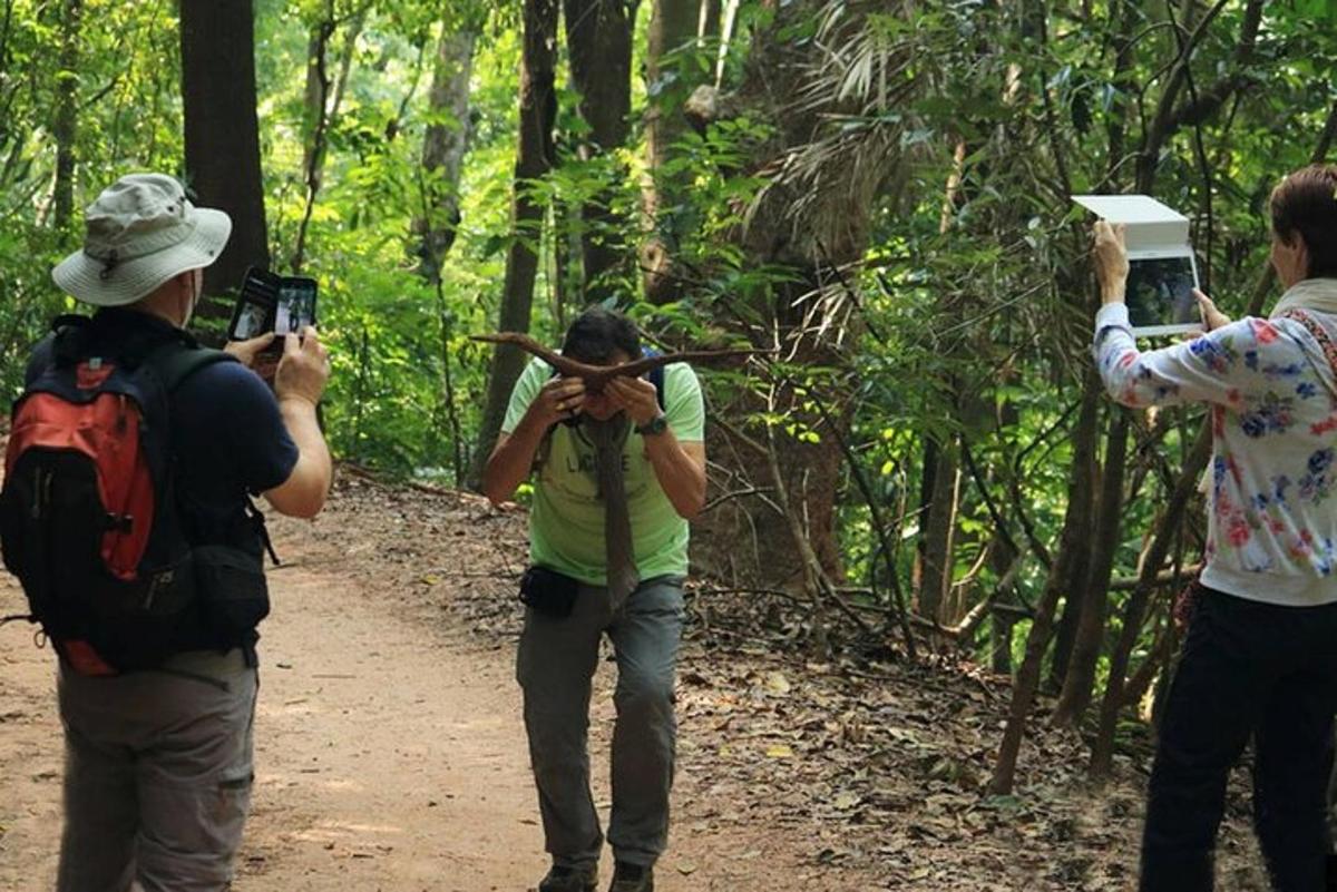 a group of people taking pictures on a trail