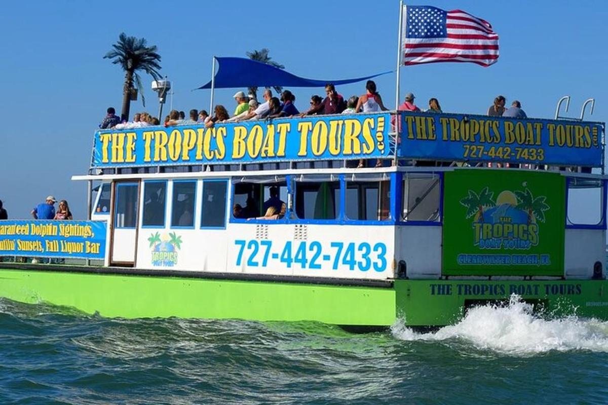 a tour boat in the water with people on it