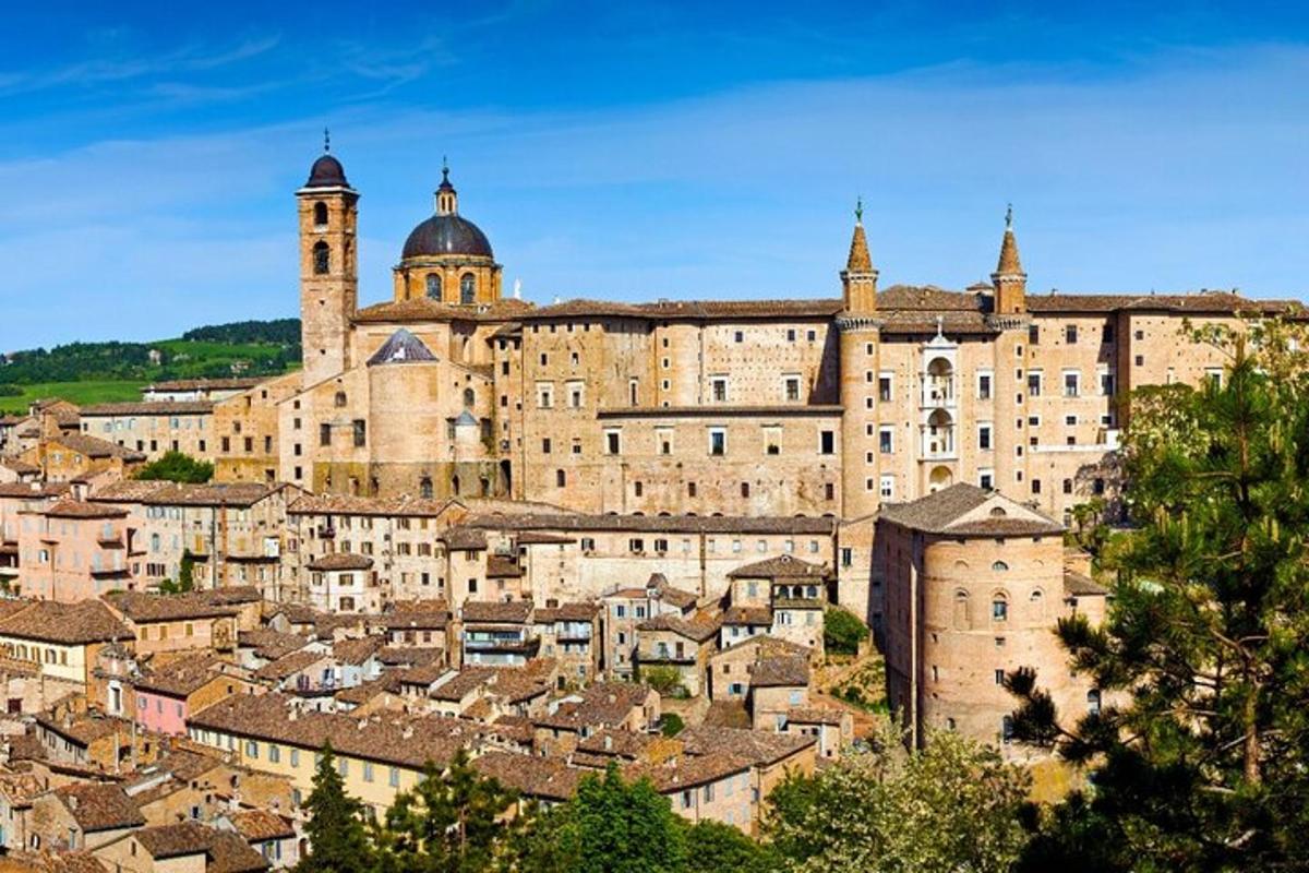 a large stone building with a bunch of buildings