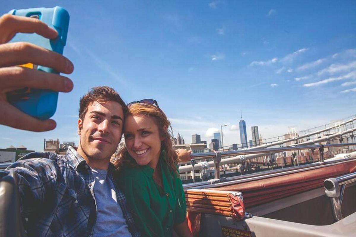 a man and woman posing for a picture on a bridge