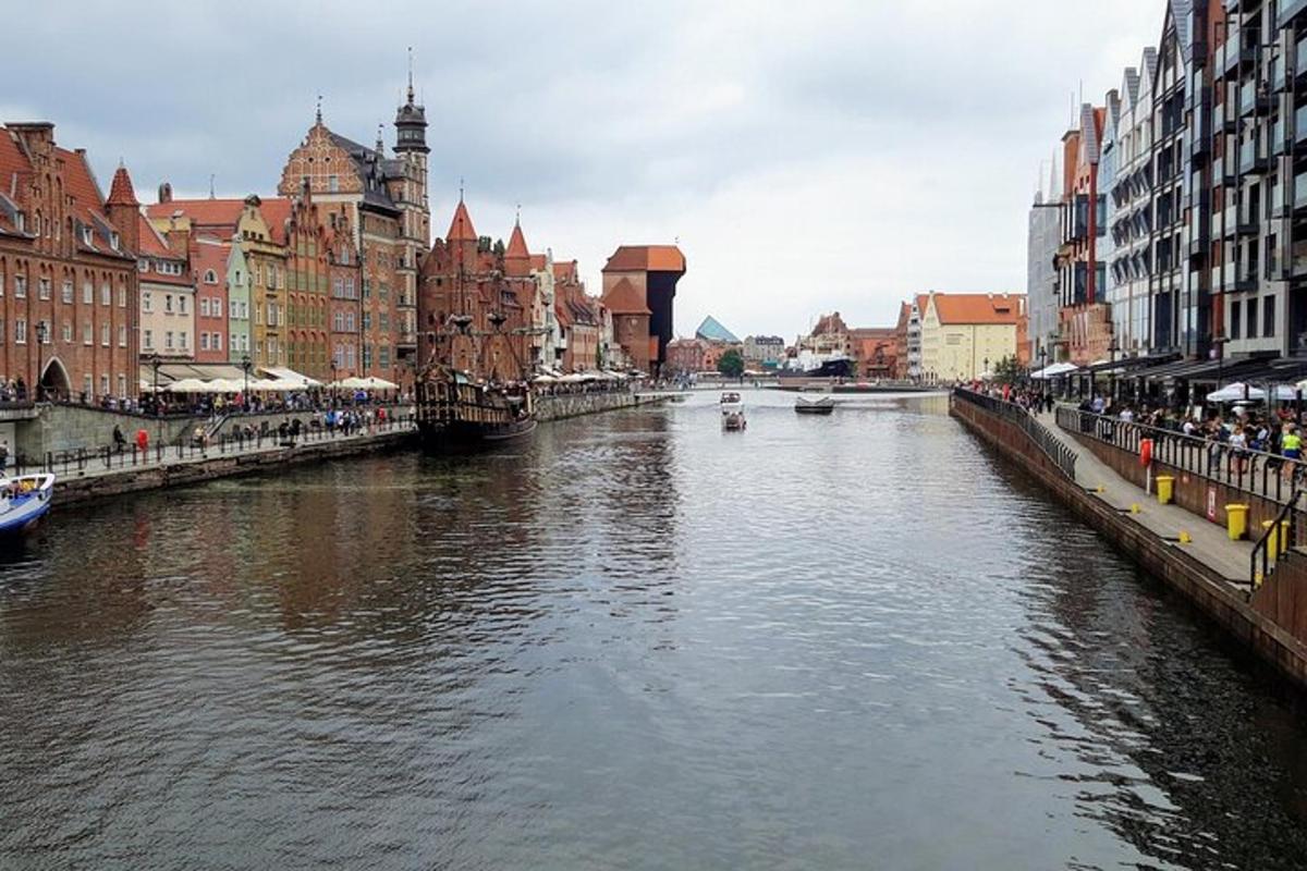 a river in the middle of a city with buildings