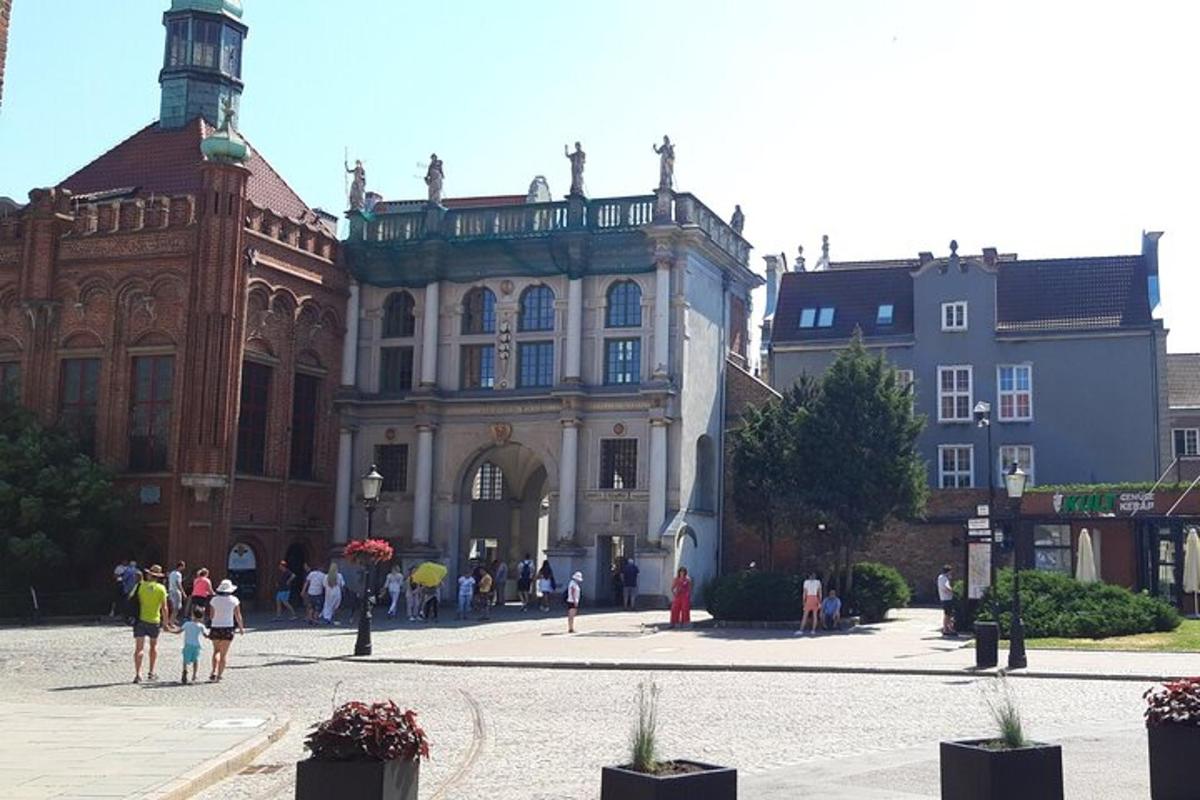 a group of people walking in front of a building